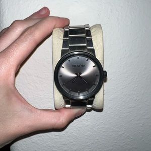 Silver and gunmetal black Nixon watch